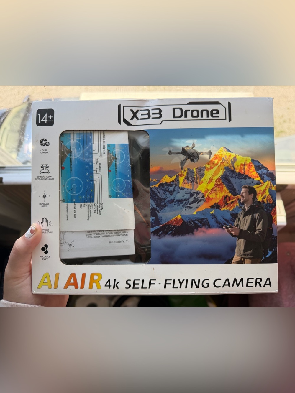 X33 Drone AI Air 4K Self-Flying Camera - Black with Gold Accents